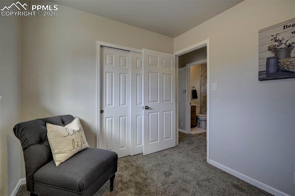 701 Erie Road Colorado Springs, CO 80910 - Photo 19 of 27 a living room with furniture and a ceiling fan