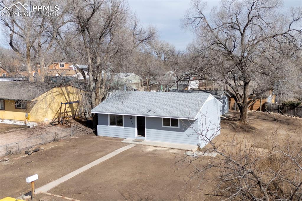 701 Erie Road Colorado Springs, CO 80910 - Photo 2 of 27 a house with trees in front of it