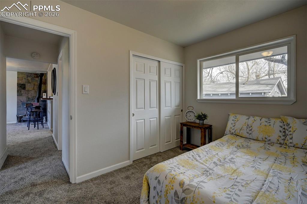 701 Erie Road Colorado Springs, CO 80910 - Photo 21 of 27 a bedroom with a bed and a window