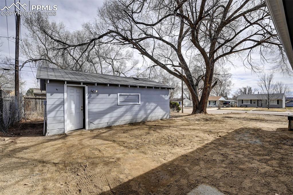 701 Erie Road Colorado Springs, CO 80910 - Photo 25 of 27 a house with trees in front of it