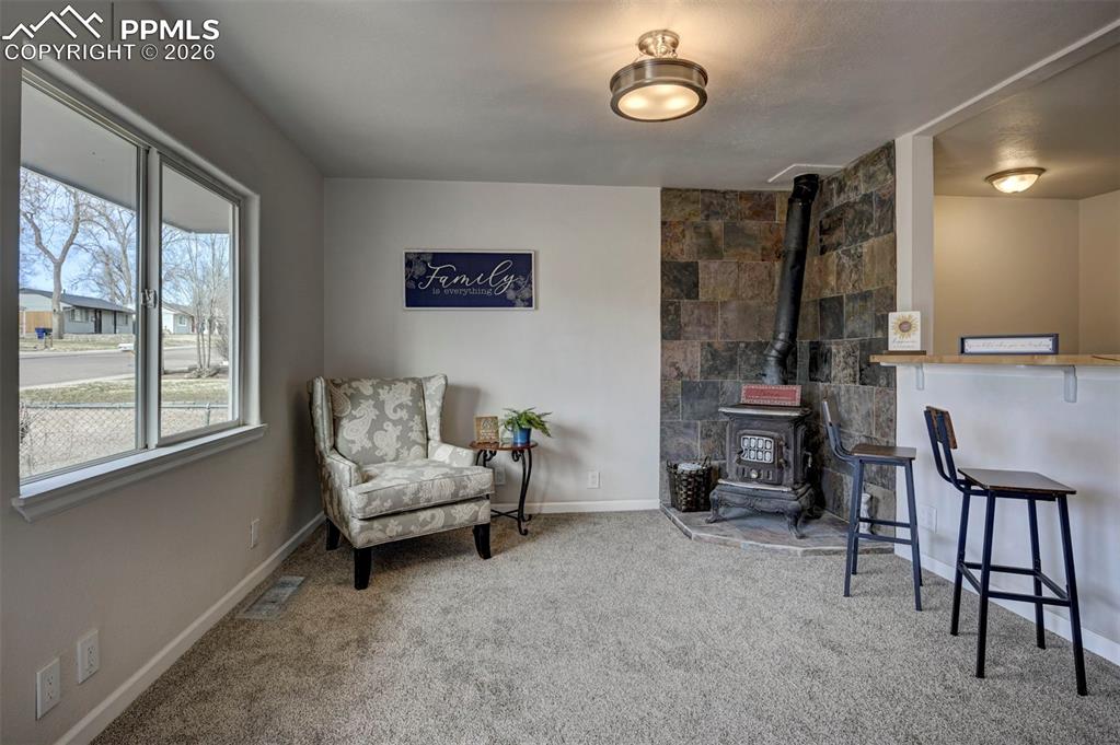 701 Erie Road Colorado Springs, CO 80910 - Photo 9 of 27 a living room with furniture and a fireplace