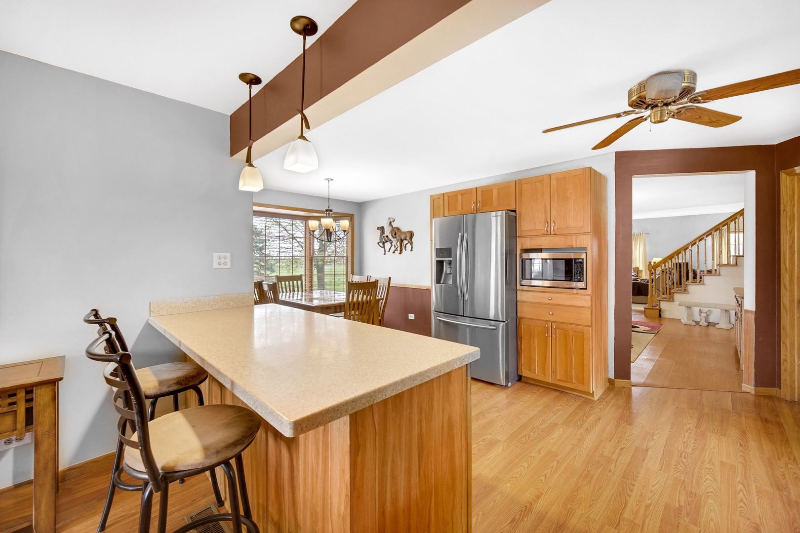 32443 Wilton Road Manteno, IL 60950 - Photo 11 of 48 a kitchen with stainless steel appliances kitchen island a table and chairs in it