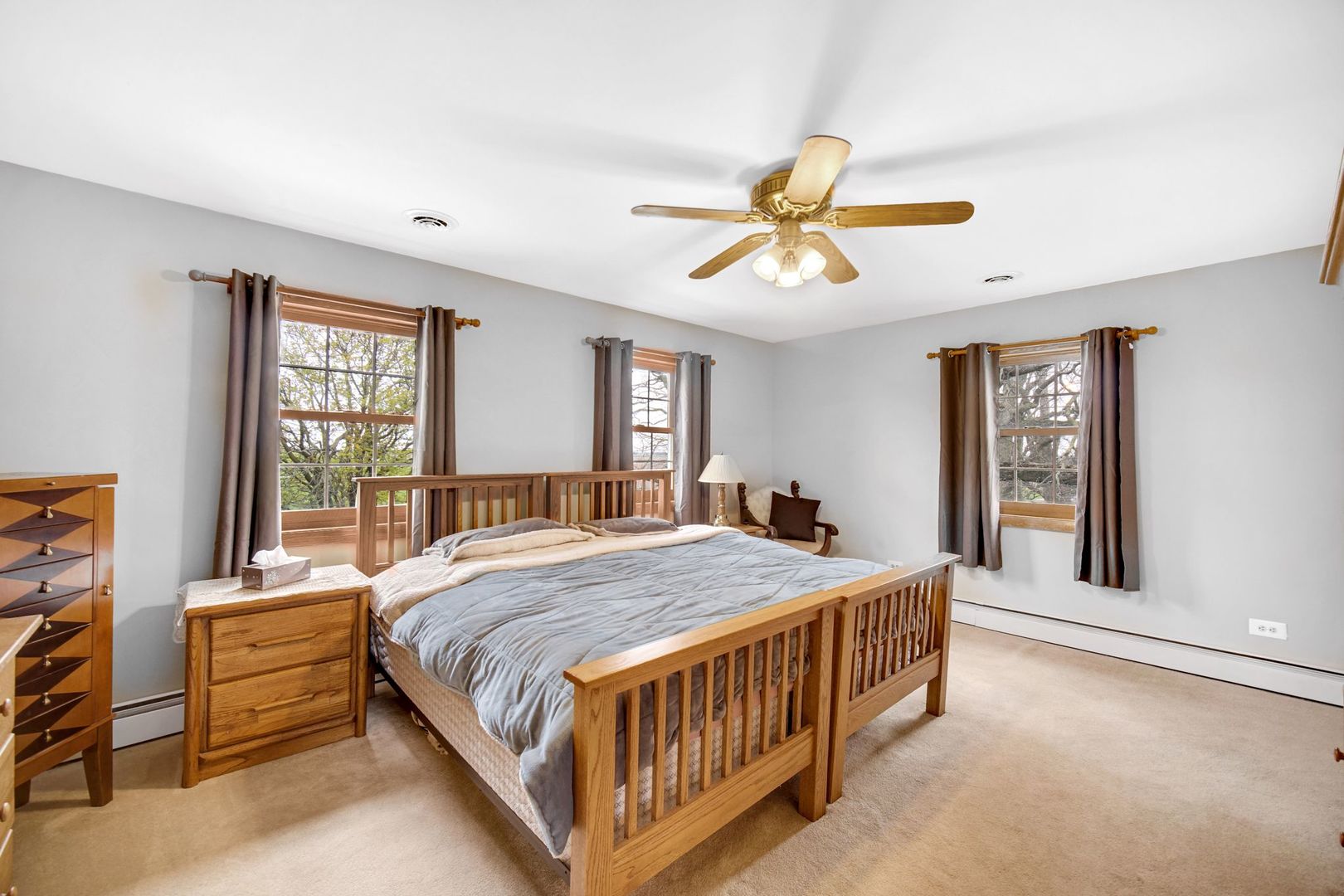 32443 Wilton Road Manteno, IL 60950 - Photo 17 of 48 a bedroom with a bed next to a window and a chandelier
