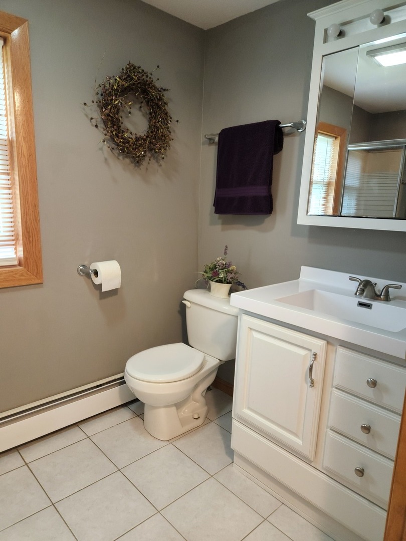 32443 Wilton Road Manteno, IL 60950 - Photo 22 of 48 a bathroom with a toilet sink and mirror