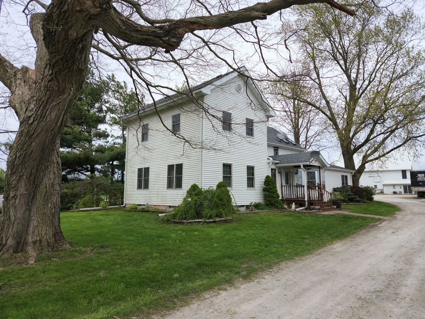 32443 Wilton Road Manteno, IL 60950 - Photo 4 of 48 a white house that has a tree in front of it