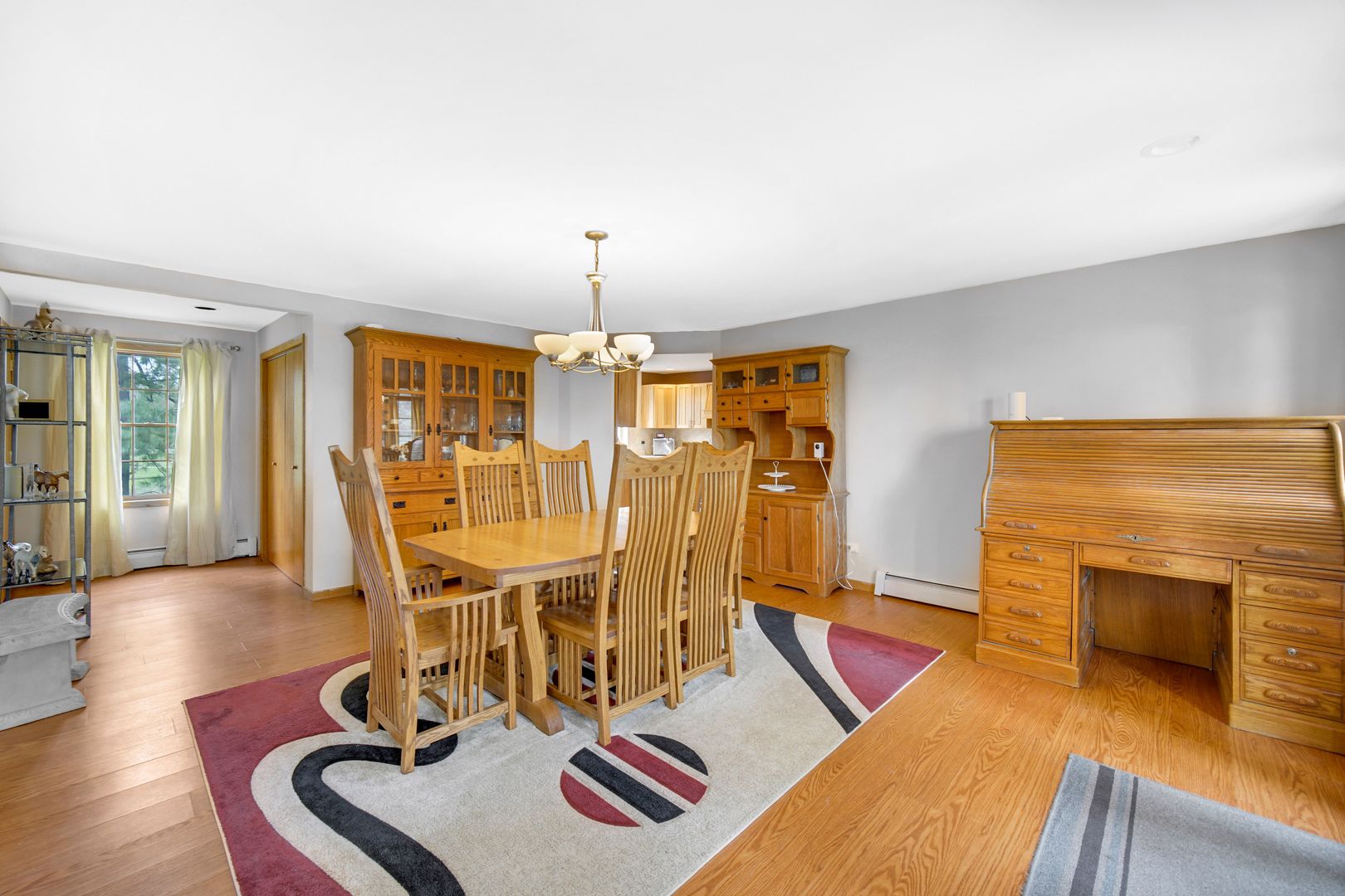 32443 Wilton Road Manteno, IL 60950 - Photo 9 of 48 a view of a dining room with furniture a chandelier and wooden floor