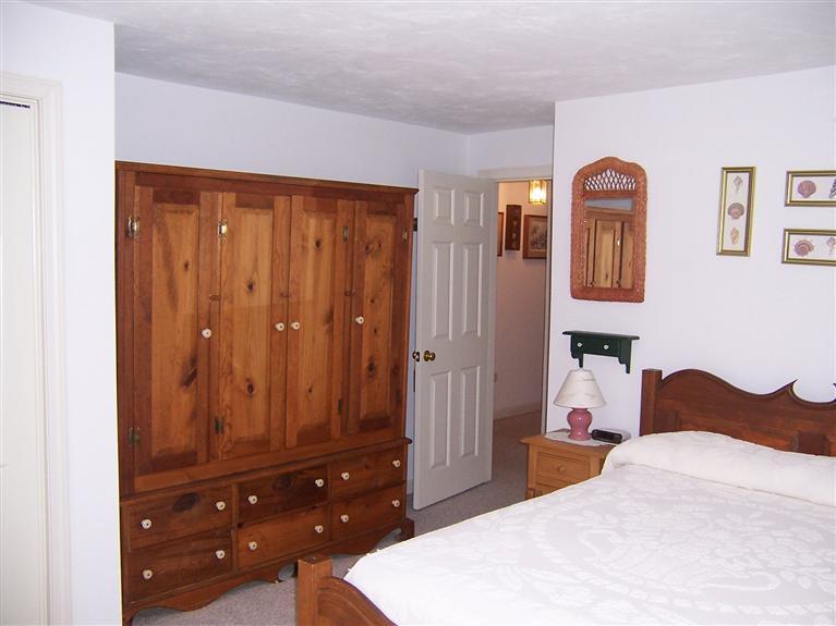 47 Chipman Road Sandwich, MA 02563 - Photo 24 of 31 a bedroom with a bed and a dresser