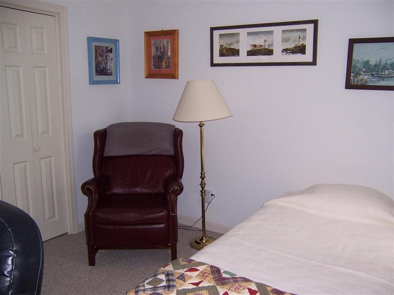 47 Chipman Road Sandwich, MA 02563 - Photo 26 of 31 a bedroom with a bed and a lamp on dresser