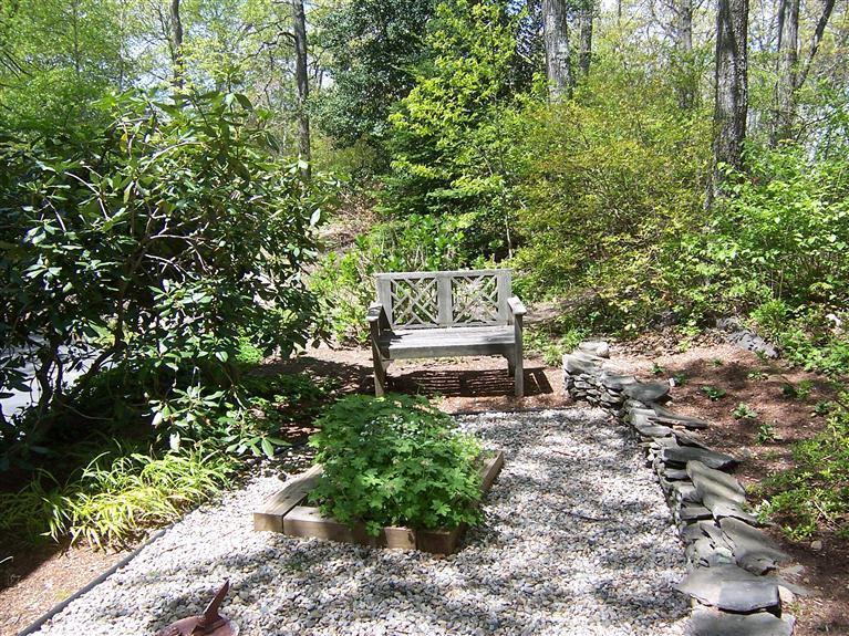 47 Chipman Road Sandwich, MA 02563 - Photo 8 of 31 a view of a bench in a garden