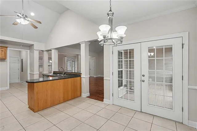 a large kitchen with kitchen island granite countertop stainless steel appliances cabinets and a counter top space