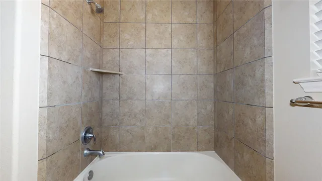 a bathroom with a bath tub