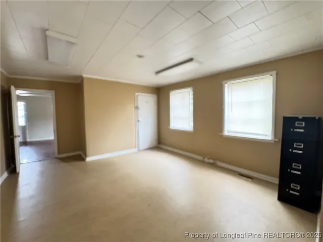 a view of an empty room with a window