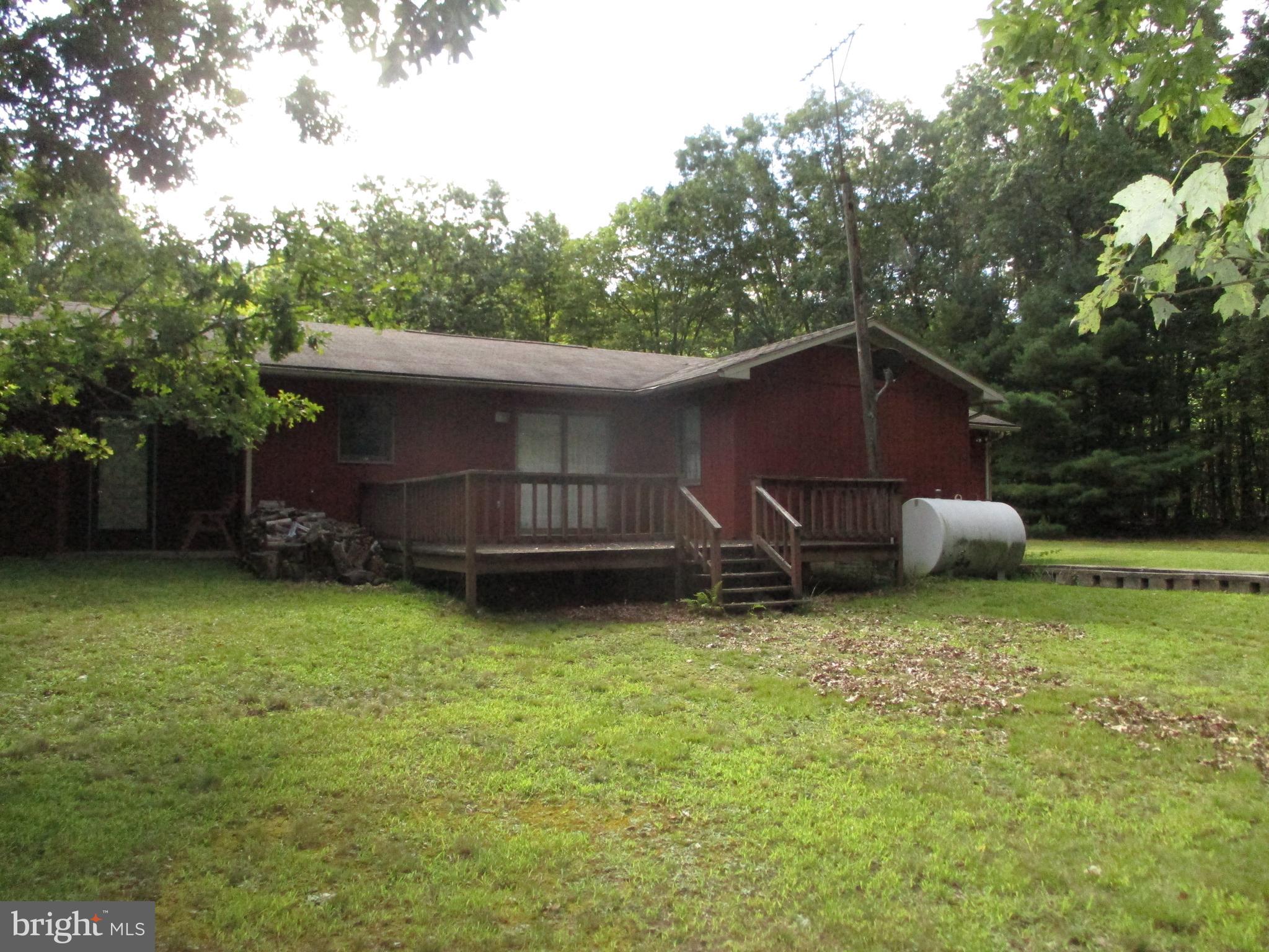 807 Green Glade Road Swanton, MD 21561 - Photo 3 of 12 a backyard of a house with lots of green space