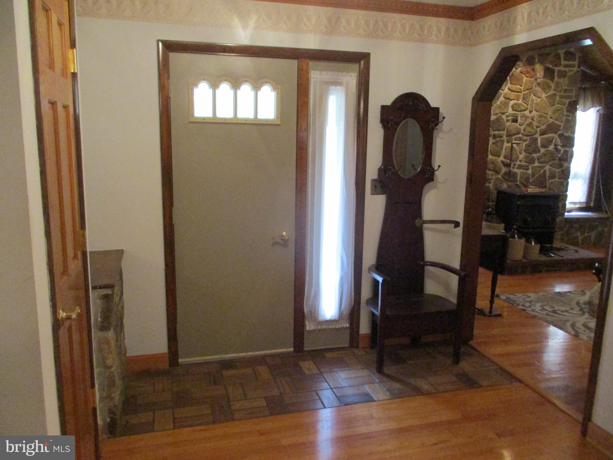 807 Green Glade Road Swanton, MD 21561 - Photo 6 of 12 a view of entryway livingroom and hall with wooden floor