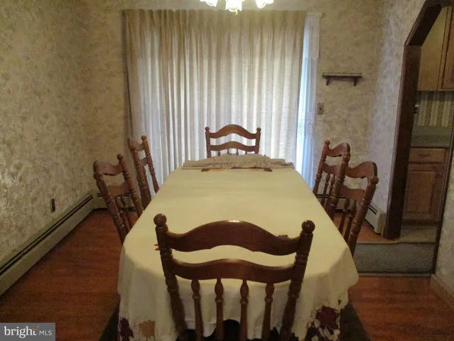 a view of a balcony dining area with furniture