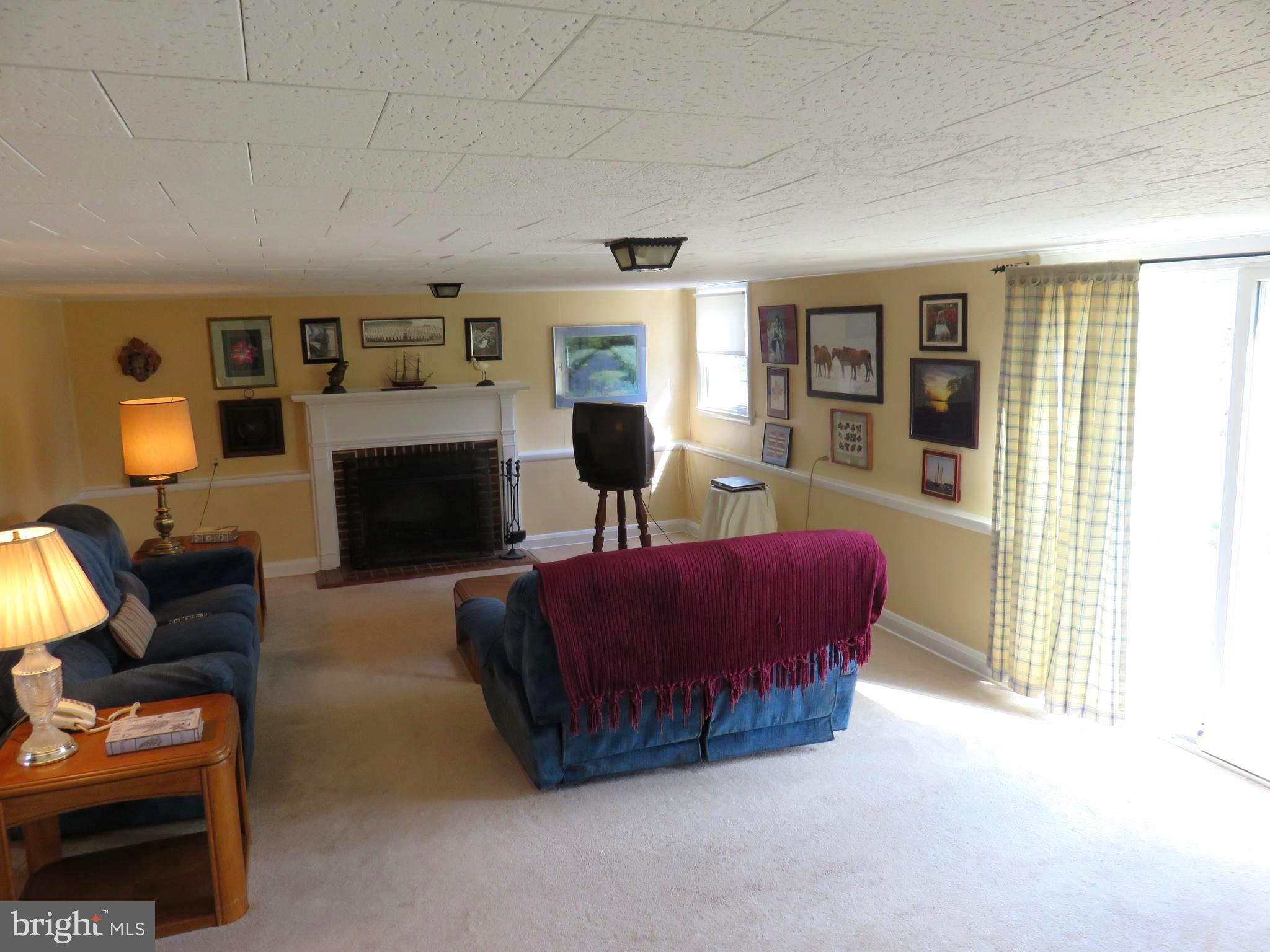 8219 Thornton Road Towson, MD 21204 - Photo 3 of 30 LOWER LEVEL FAMILY ROOM WITH SLIDERS TO YARD