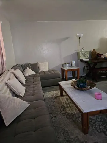 a kitchen with a stove top space and a sink