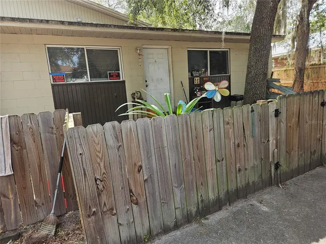 a view of a backyard with large trees