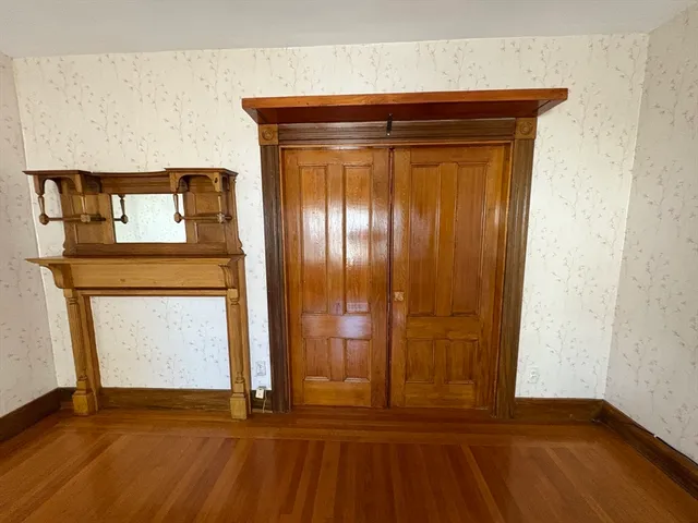 a view of front door with wooden floor