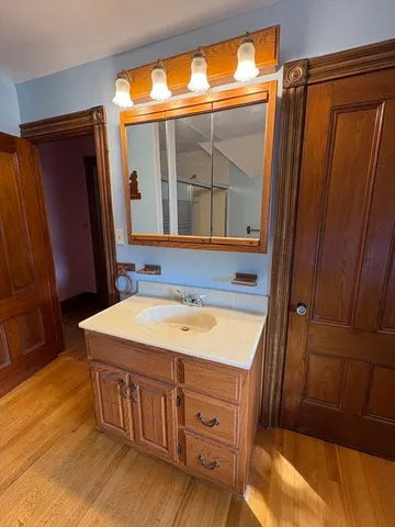 a bathroom with a sink and a mirror