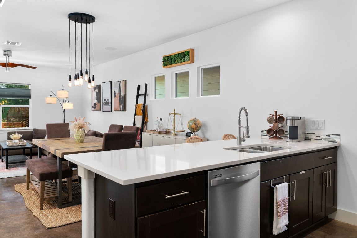 3012 Neal Street Austin, TX 78702 - Photo 12 of 39 a view of a kitchen counter space and living room