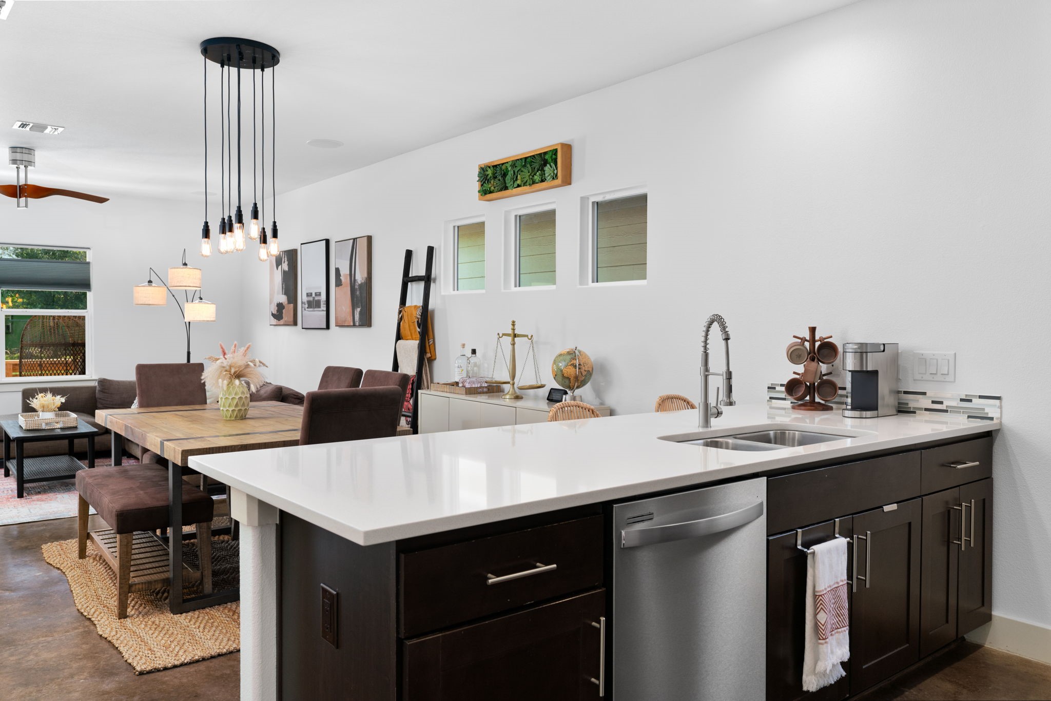 3012 Neal Street Austin, TX 78702 - Photo 12 of 39 a view of a kitchen counter space and living room