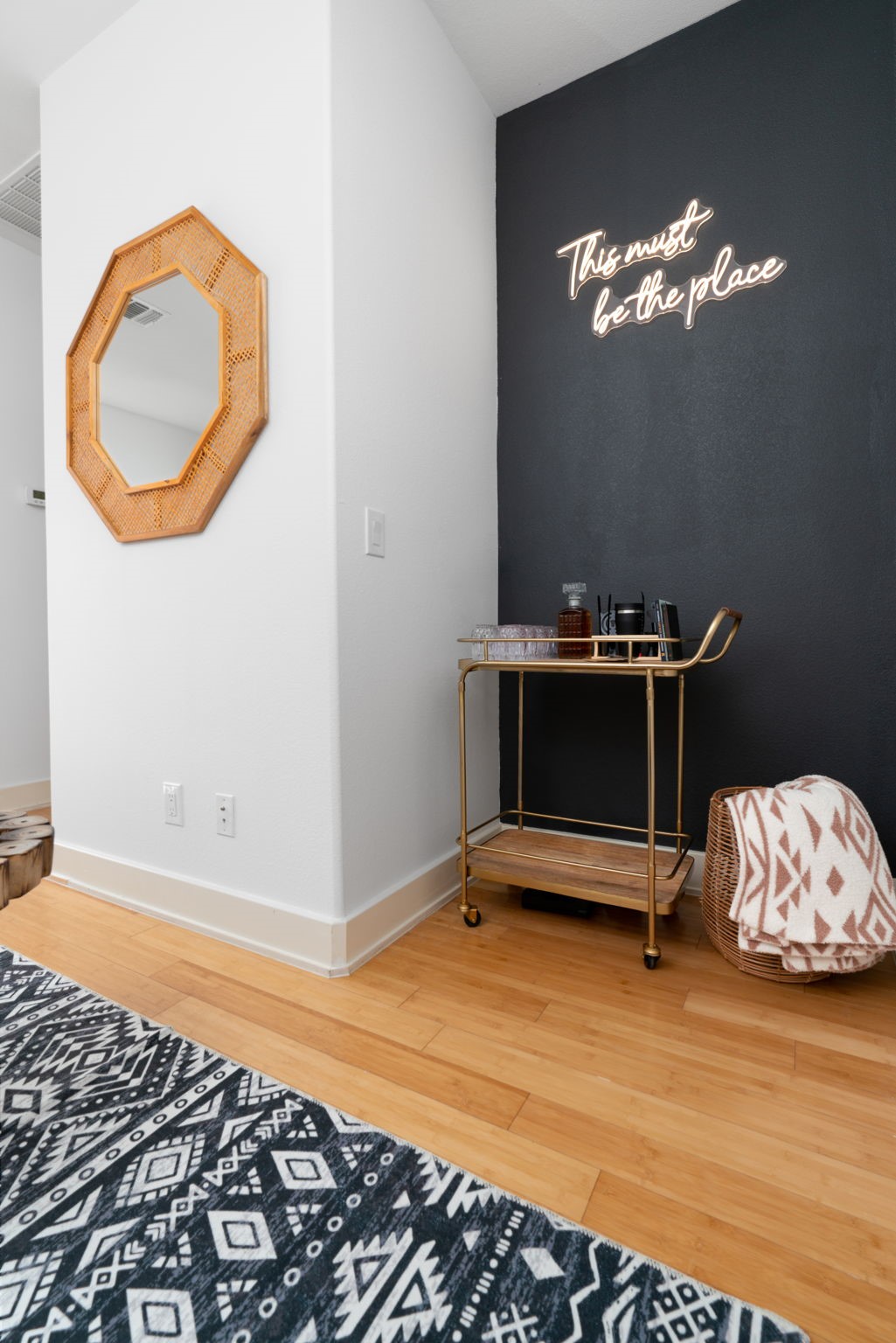 3012 Neal Street Austin, TX 78702 - Photo 16 of 39 a bedroom with a bed and a chandelier