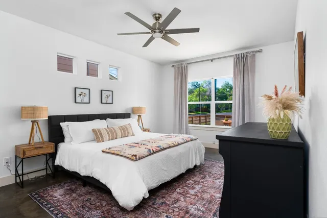 a bedroom with a bed and a window