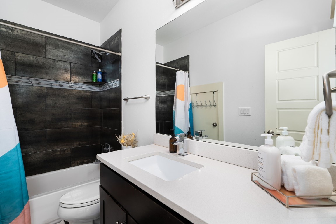 3012 Neal Street Austin, TX 78702 - Photo 25 of 39 a bathroom with a sink a toilet and shower