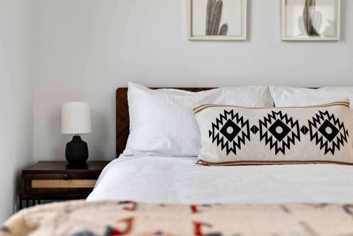 3012 Neal Street Austin, TX 78702 - Photo 27 of 39 a bedroom with a bed and a painting on the wall