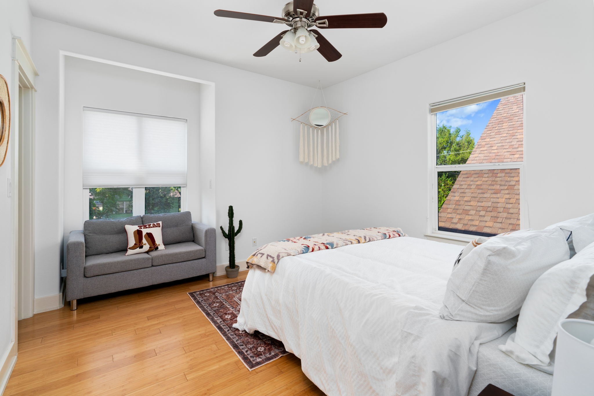 3012 Neal Street Austin, TX 78702 - Photo 28 of 39 a bedroom with a bed couch and window