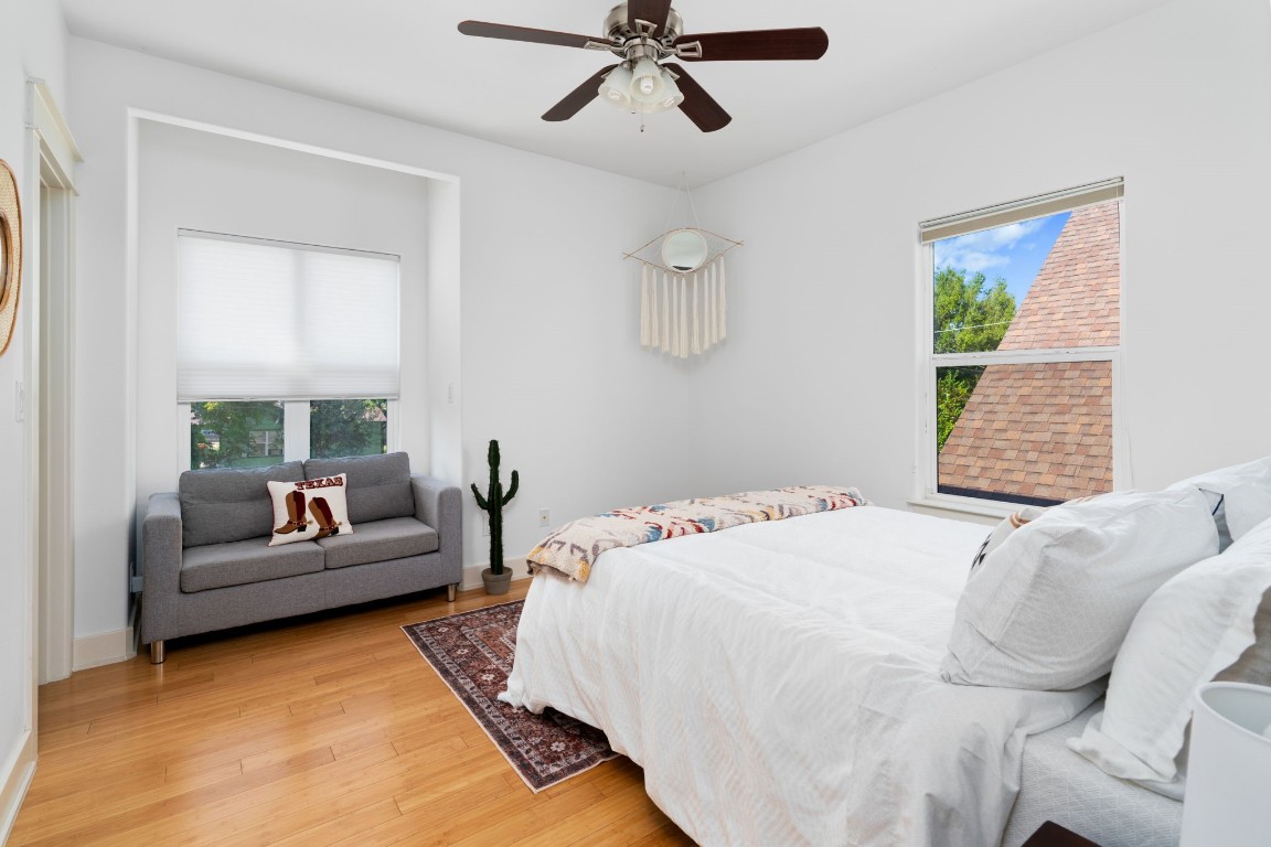 3012 Neal Street Austin, TX 78702 - Photo 28 of 39 a bedroom with a bed couch and window