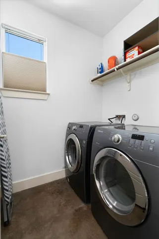 a utility room with dryer and washer