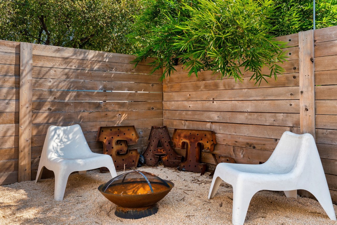 3012 Neal Street Austin, TX 78702 - Photo 34 of 39 a couple of chairs sitting in a backyard