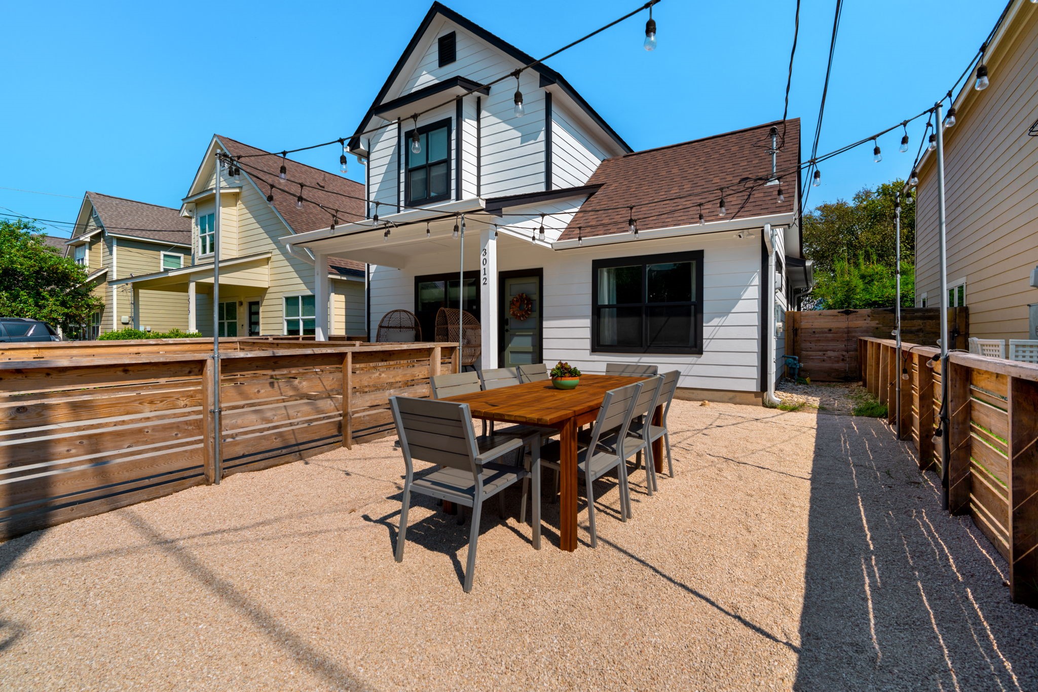 3012 Neal Street Austin, TX 78702 - Photo 37 of 39 a backyard of a house with table and chairs
