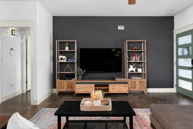 a living room with furniture and a flat screen tv