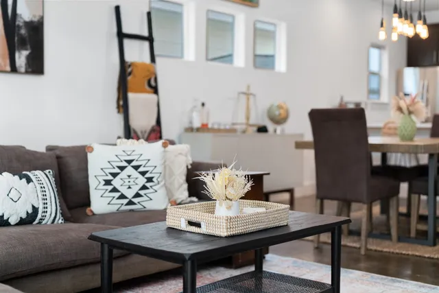 a view of a dining room with furniture and wooden floor