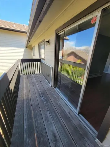 a view of deck with wooden floor and bench