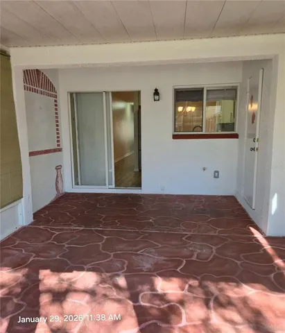 a view of a big room with wooden floor and closet