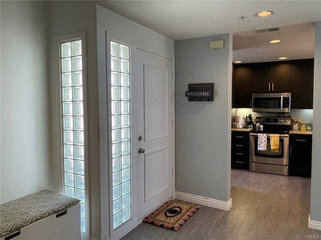 2233 Martin, Unit 413 Irvine, CA 92612 - Photo 12 of 38 a view of kitchen with windows and refrigerator