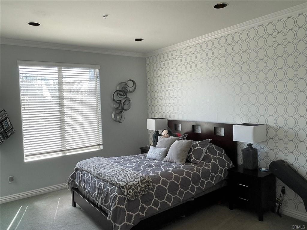 2233 Martin, Unit 413 Irvine, CA 92612 - Photo 26 of 38 a bed sitting in a bedroom next to a window