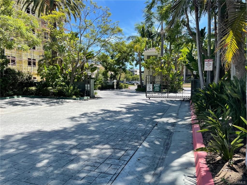2233 Martin, Unit 413 Irvine, CA 92612 - Photo 3 of 38 a view of road with large trees