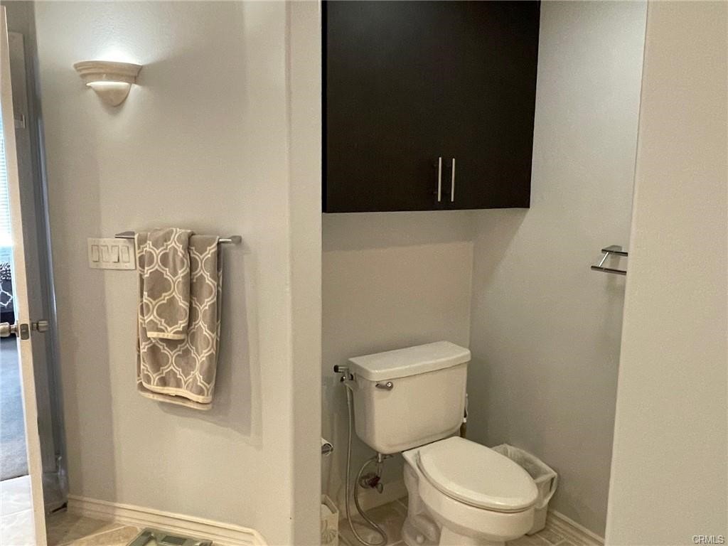 2233 Martin, Unit 413 Irvine, CA 92612 - Photo 31 of 38 a white toilet sitting next to a bathroom sink