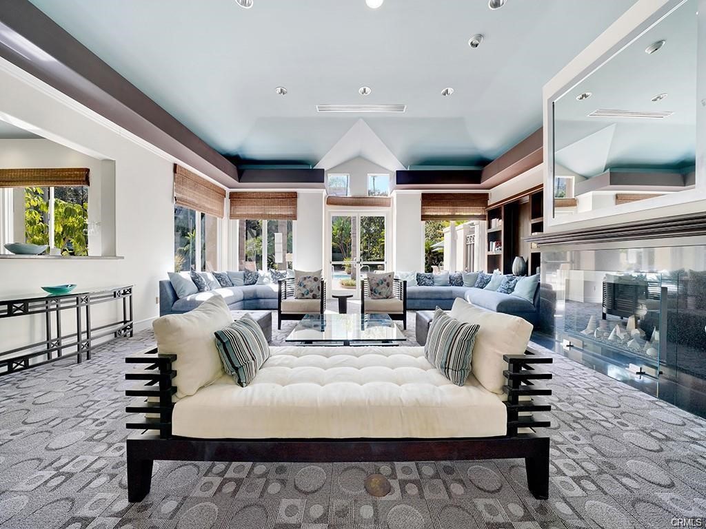 2233 Martin, Unit 413 Irvine, CA 92612 - Photo 38 of 38 a living room with furniture a large window and chairs