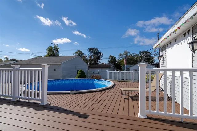 a view of a backyard with sitting area