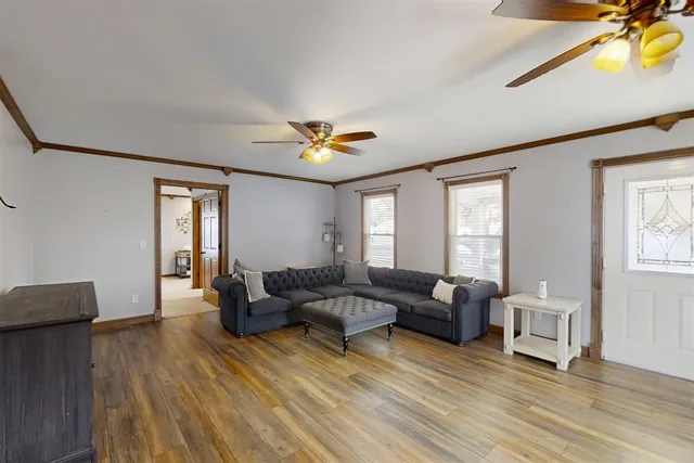 a living room with furniture and a window