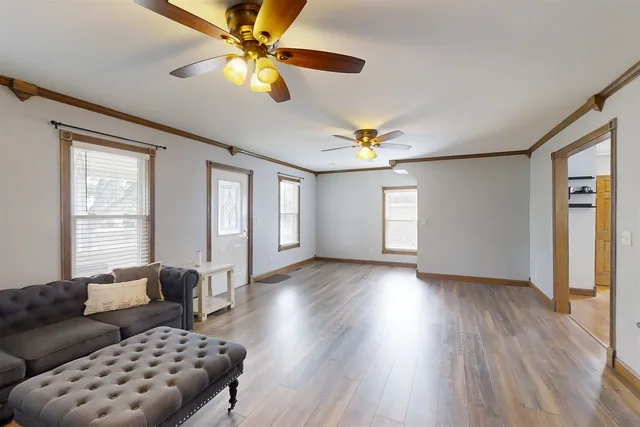 a living room with furniture and a window