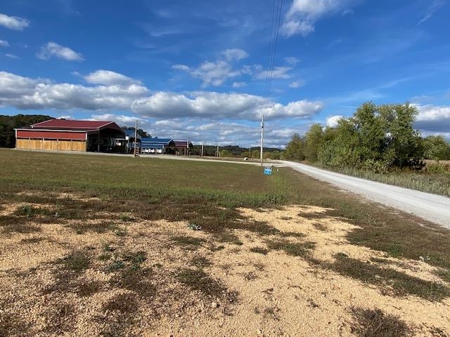 1929 Hardin Bottom River Road Clifton, TN 38425 - Photo 16 of 18 a view of a lake with a big yard