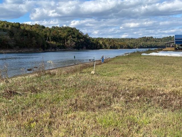 1929 Hardin Bottom River Road Clifton, TN 38425 - Photo 6 of 18 a view of a lake with sunset in background