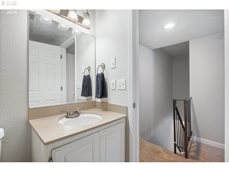 2921 Northeast Rene Avenue, Unit 15B Gresham, OR 97030 - Photo 10 of 22 a bathroom with a sink vanity and a mirror